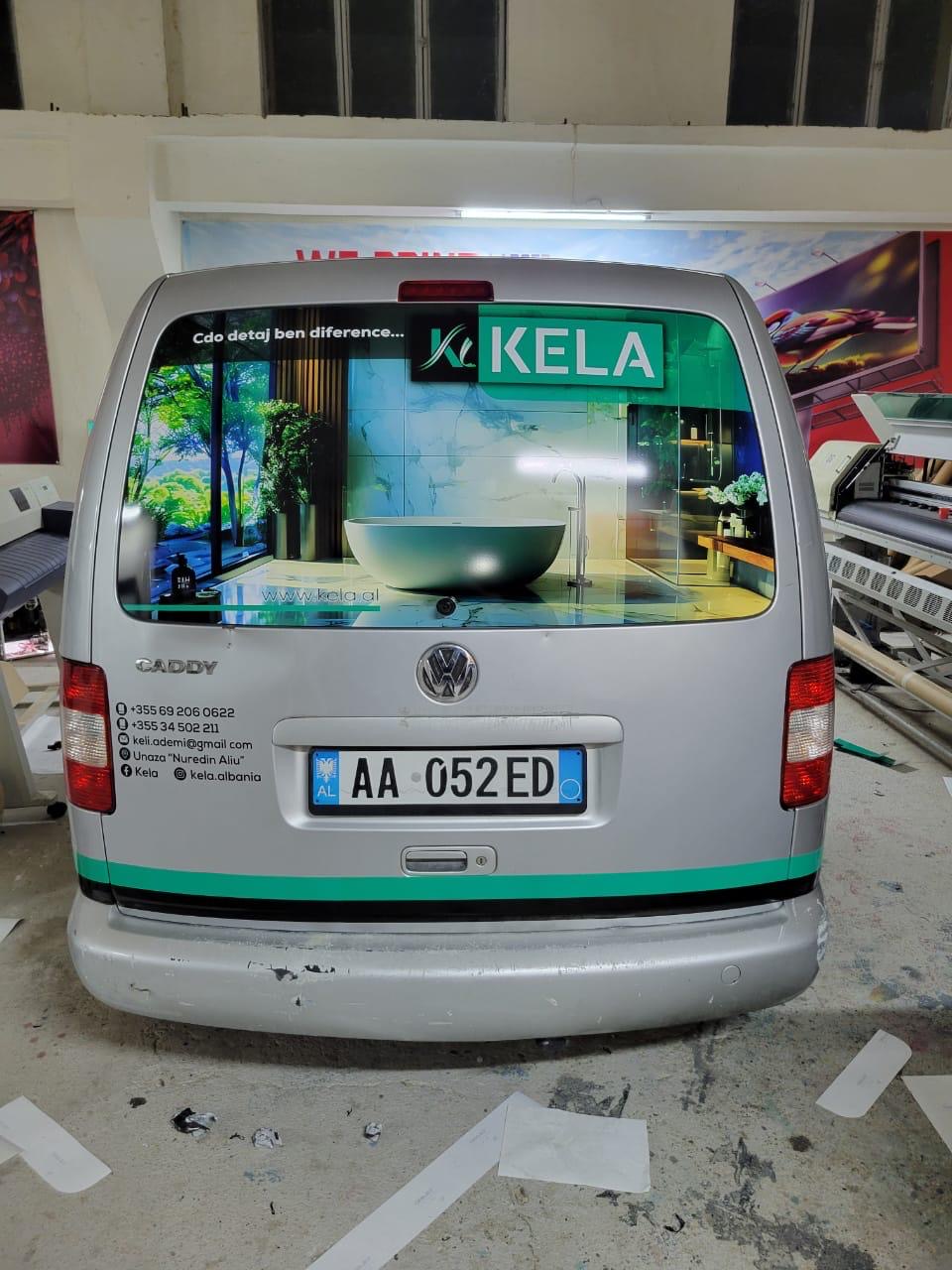 VW Caddy rear window with a modern KELA bathroom graphic and the slogan Çdo detaj bën diferencë
